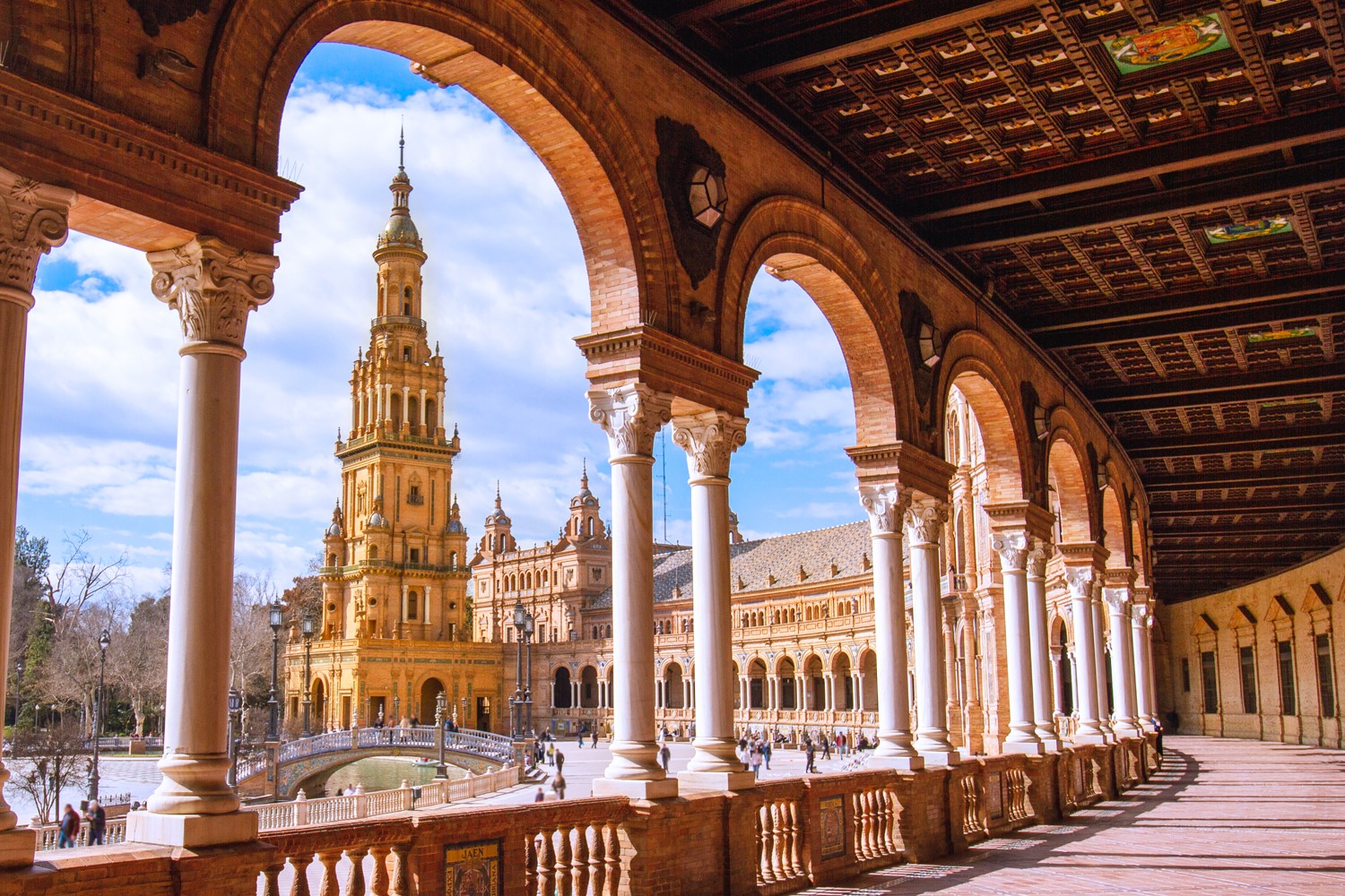 Arched view of Plaza de España tower in Seville
