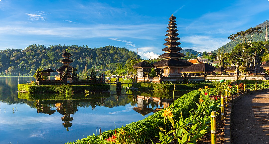 Waterside Temple surrounded by mountains